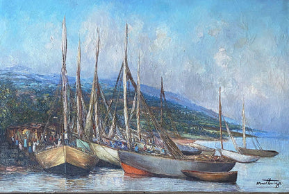 Ernst Louizor Haitian painting of fishing boats docked at harbor with villagers and coastal hills in background.